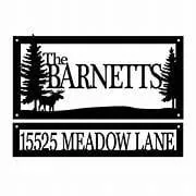 A metal address sign with a family name and trees.