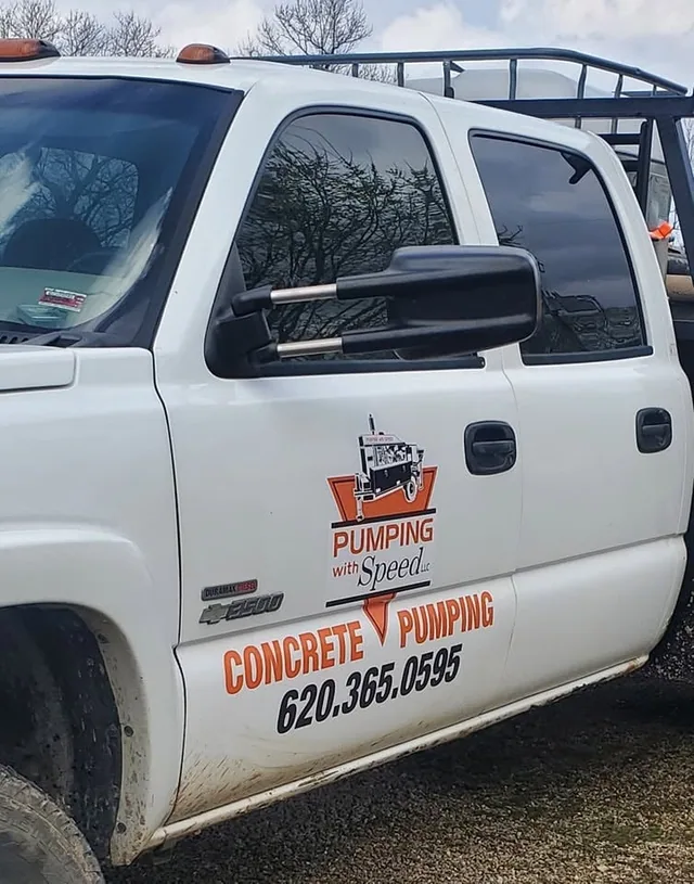 Red lettering and a logo on a white pickup.