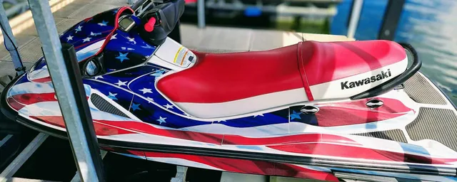 Red, white and blue graphics on a personal watercraft.