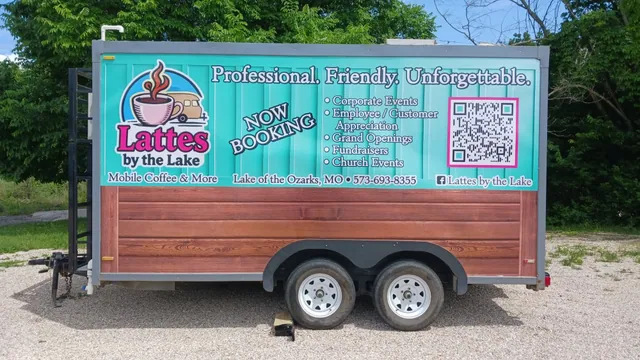 A coffee trailer with a wood-look wrap and a logo.