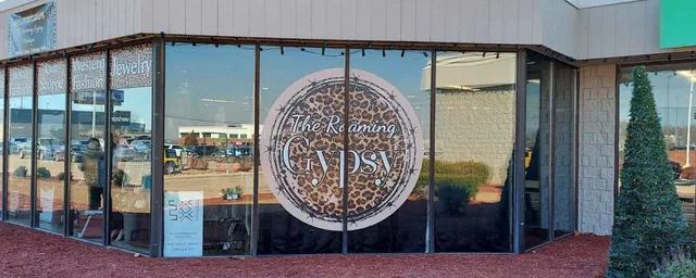 A large circular graphic on storefront windows.